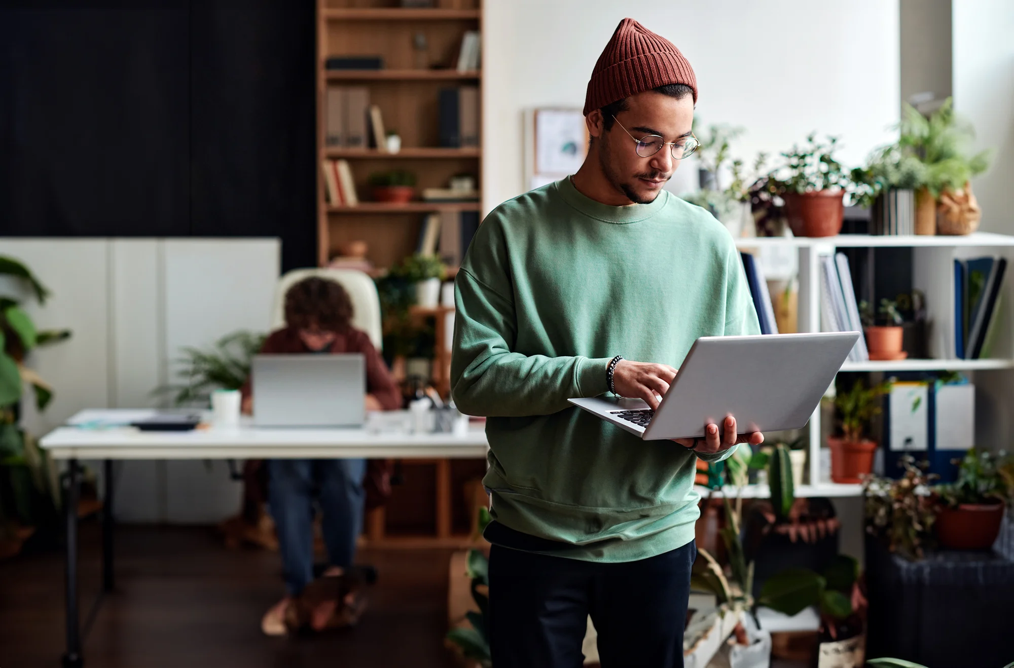 Digiten's stock image with man holding the laptop